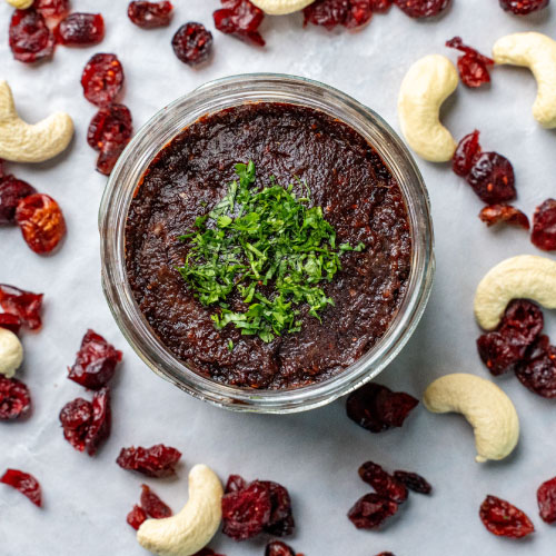 Zessa Vegan Cream Cheese – Cranberry Sweet & Spicy Zessa Gourmet Vegan Cream Cheese – Cranberry Sweet & Spicy Flavor in serving bowl garnished with herbs